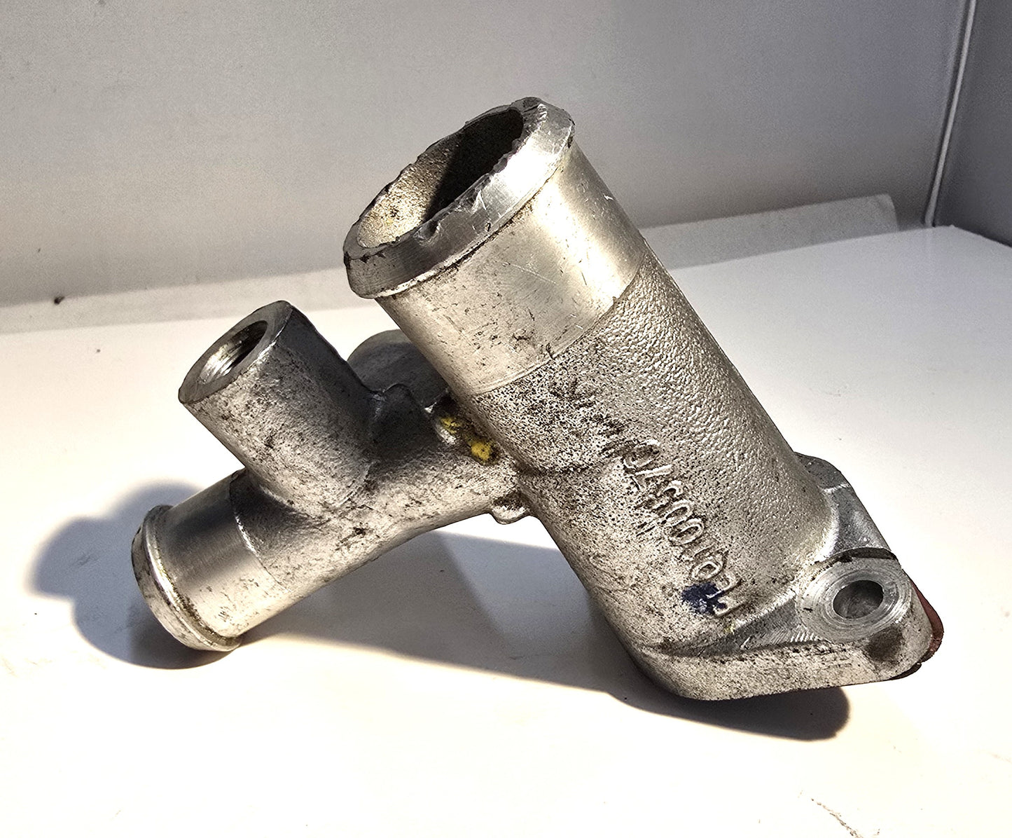 A111E6407S - Elbow-Coolant Outlet