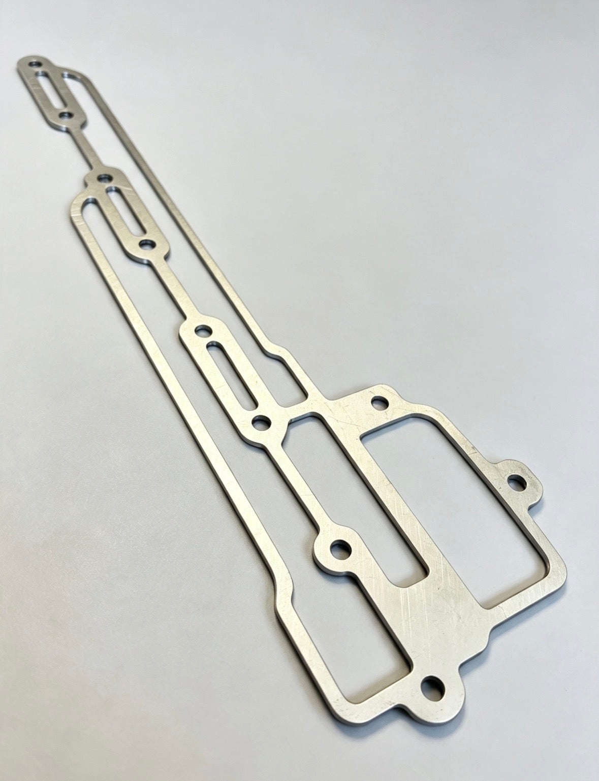 C910E1468/1MM>6MM - Gasket-Scavenge Manifold 1mm to 6mm