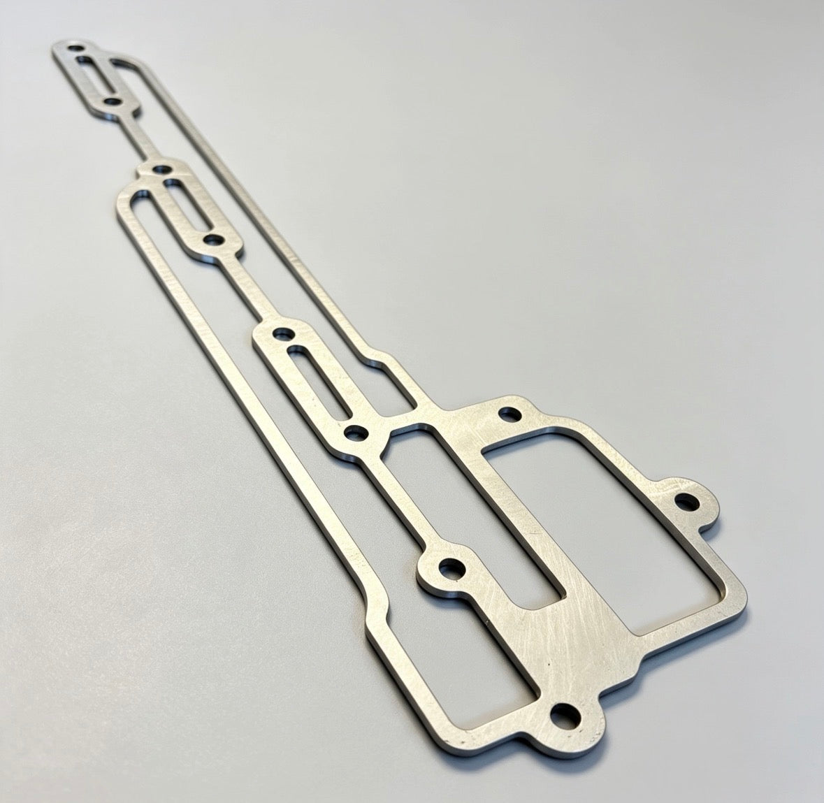 C910E1468/1MM>6MM - Gasket-Scavenge Manifold 1mm to 6mm